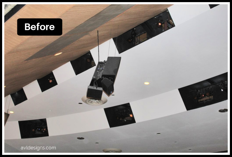 Before: auditorium ceiling with suspended black speakers hanging from wires and white ceiling panels, avldesigns.com watermark visible.