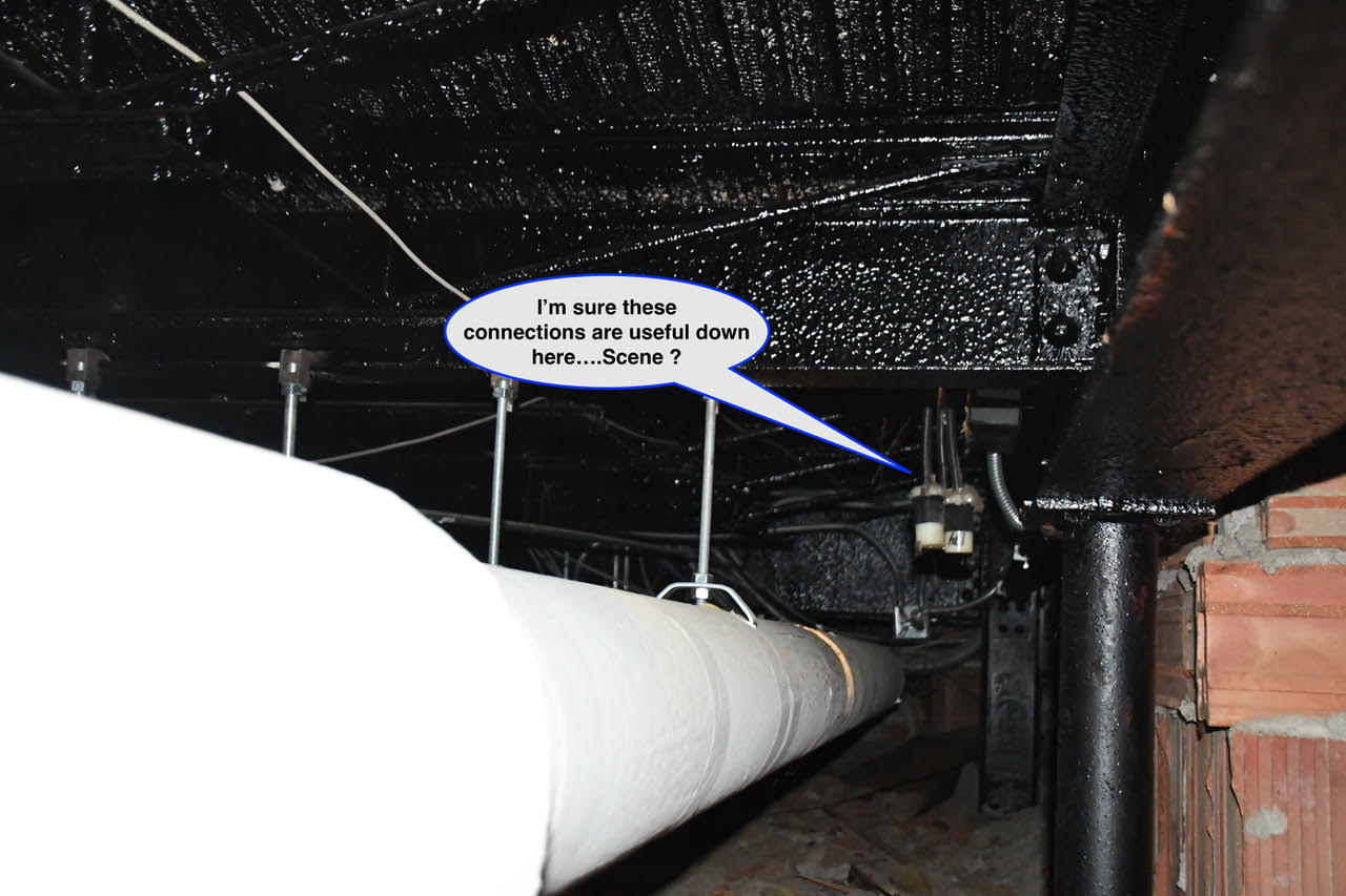 WOS August 1 Underside of a crawl space showing a large white pipe and metal supports with a speech bubble: 'I'm sure these connections are useful down here... Scene ?'