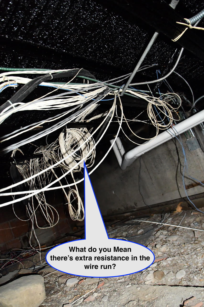 WOS August 2 Cluttered crawl-space with tangled electrical wires; speech bubble reads, "What do you mean there’s extra resistance in the wire run?"